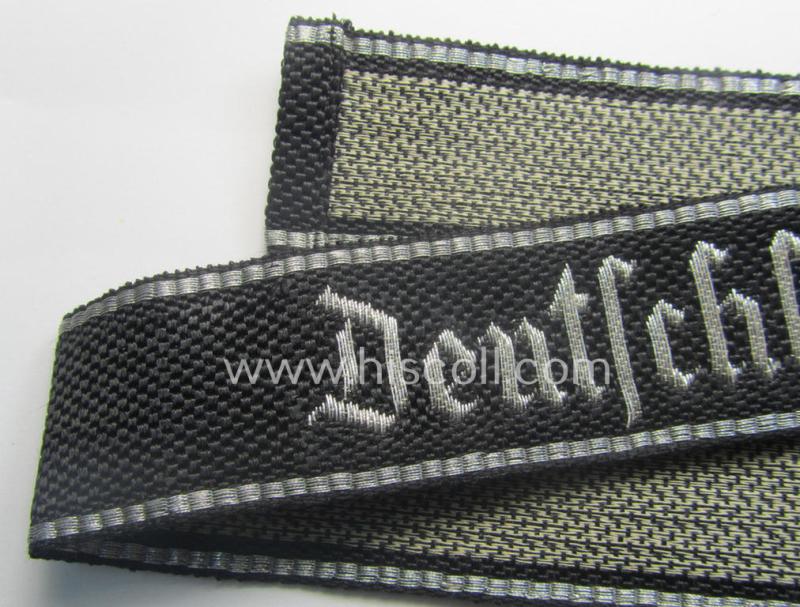 Stunning, Waffen-SS officers-type, 1939/40-pattern cuff-title (ie. 'Ärmelstreifen') as executed in flat-wire 'BeVo'-weave-pattern (in Gothic-styled script!) for an officer who served within the: SS-Rgt. 'Deutschland' (2. SS-Pz-Div. "Das Reich...