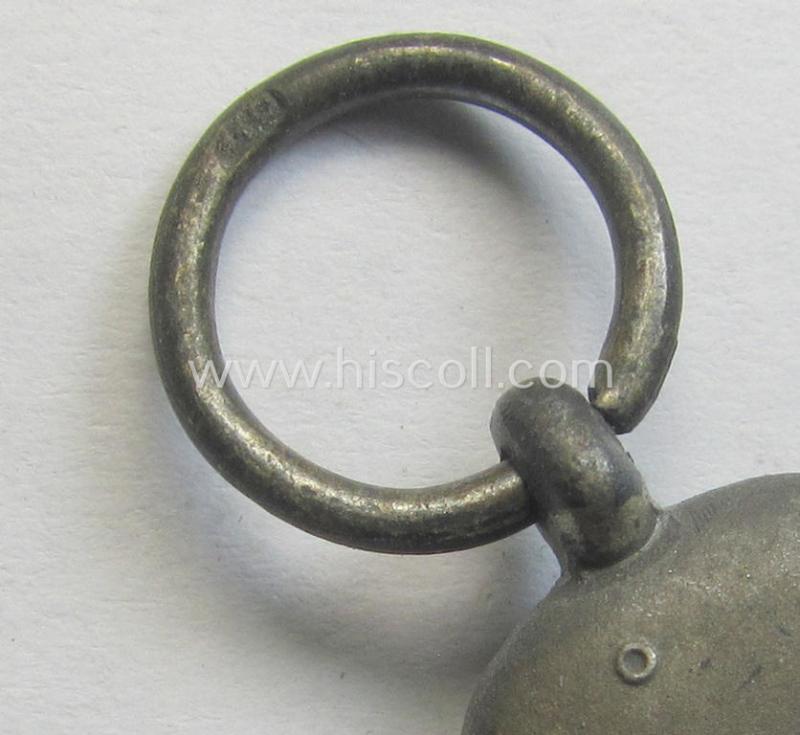 Attractive medal-set: 'Winterschlacht im Osten 1941-42' being a maker- (ie. '110'-) marked- (and/or 'Feinzink'-based) specimen by the maker: 'Otto Zappe' and that comes together with its (non-confectioned) ribbon (ie. 'Bandabschnitt')