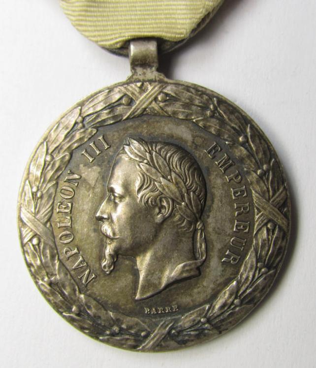 Attractive French, 'Second Empire-period', so-called: 'Expedition to Mexico'-campaign-medal (ie. 'Médaille Commémorative de l'Expédition du Mexique') that comes mounted on its period-ribbon as issued