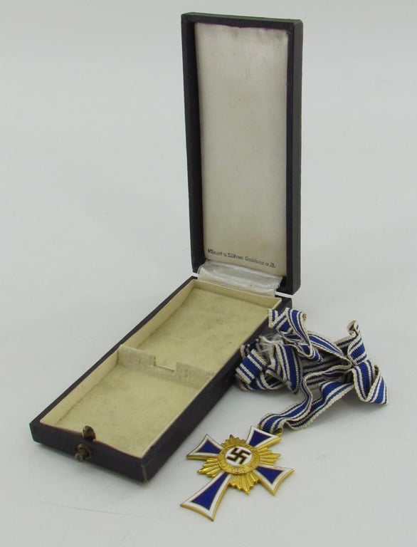 Mother’s cross in gold with box ( Klamt und Söhne )