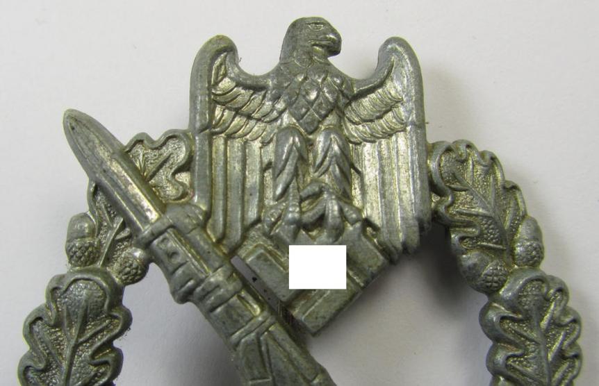 'Infanterie-Sturmabzeichen in Silber' being a non-maker-marked- and/or zinc- (ie. 'Feinzink'-) based specimen of the so-called: 'pillow-crimped'-pattern (as was produced by a to date still unidentified maker)