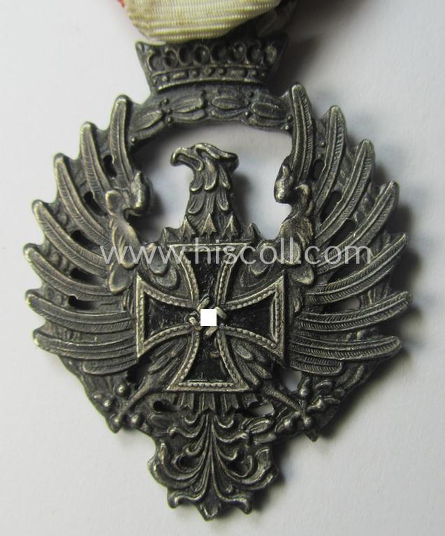 Attractive example of a Spanish-issued, campaign-medal of the Spanish Blue Division in Russia called: 'Medalla Conmemorativa Division Azul - Medalla de Tropa 1941' that comes mounted on its (typically Spanish) mounted ribbon as issued and/or worn