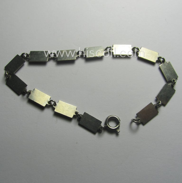 Unusual, WH (LW, Heeres, RAD etc. ie. Third Reich-) related, metal-(ie. genuine-silver?) based so-called: 'souvenir'-armband (ie. 'Kettchen') depicting the engraved text: 'Westwall Gruss'