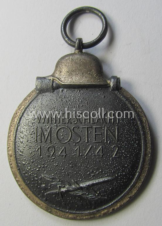 Attractive medal-set: 'Winterschlacht im Osten 1941-42' being a maker- (ie. '14'-) marked- (and/or 'Feinzink'-based) specimen by the maker: 'L.Chr. Lauer' and that comes together with its (minimally confectioned) ribbon (ie. 'Bandabschnitt'...