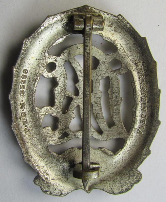 Attractive, 'Reichssportabzeichen DRL in Silber' (or: silver-class DRL sports'-badge) being a typical zinc- (ie. 'Feinzink'-) based example that is nicely maker- (ie. 'Wernstein - Jena'-) marked on its back