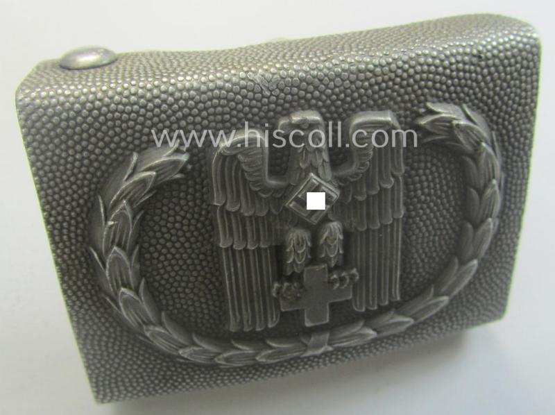 Aluminium-based, so-called: DRK (ie. 'Deutsches Rotes Kreuz'), enlisted-mens'- (ie. NCO-) type belt-buckle being a clearly maker- (ie. 'Ges.Gesch. 1'-) marked example
