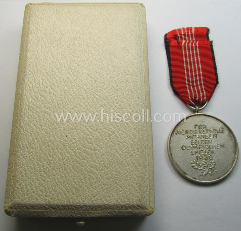 Superb, 'Deutsche Olympia-Erinnerungsmedaille 1936' being a non-maker-marked example that comes mounted onto its original ribbon (ie. 'Bandabschnitt') and that comes stored in its typical, beige-white-coloured etui as issued and stored for decade...