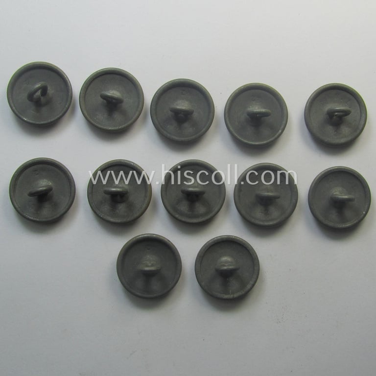 Interesting, 12-pieced set of field-grey- (ie. tan!) coloured, WH (Kriegsmarine o. Küsten-Artillerie) tunic-buttons (ie. 'Uniformknöpfe für Küsten-Marine Einheiten') being non maker-marked examples that come in a 'mint- ie. unissued', condition