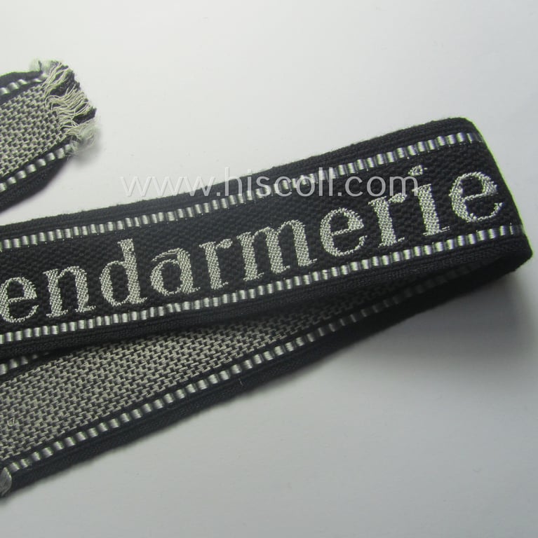 Superb - and truly rarely encountered! - example of a Waffen-SS, 'semi-BeVo'-pattern, EM- (ie. NCO-) type cuff-title (ie. 'Ärmelstreifen') as was intended for a member serving within the: 'SS-Feldgendarmerie'