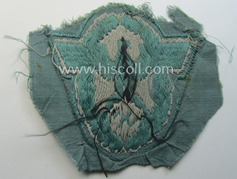 Clearly used- and/or tunic-removed, police- (ie. 'Polizei'-) related armbadge (ie. arm-eagle) being a typical 'BeVo'-woven example