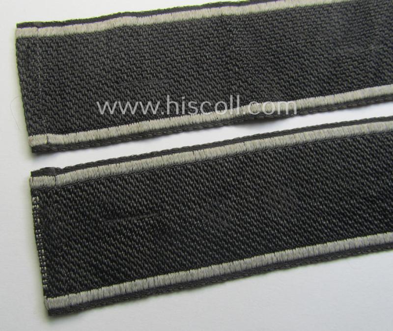 Waffen-SS, 1943-pattern cuff-title (ie. 'Ärmelstreifen') depicting the machine-woven Latin script text in silver-grey linnen as was specifically intended for usage by a member of the: 'SS-Regiment “Der Führer”