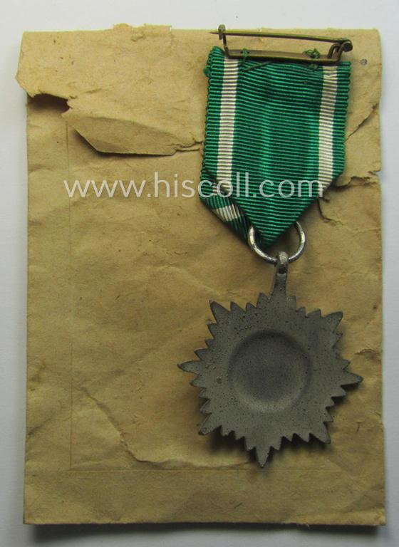 WH-related 'Tapferkeitsauszeichnung für Angehörige der Ostvölker, 2. Kl. in Silber mit Schwn.' (being a 'Feinzink'-based example that comes stored in its period pouch)