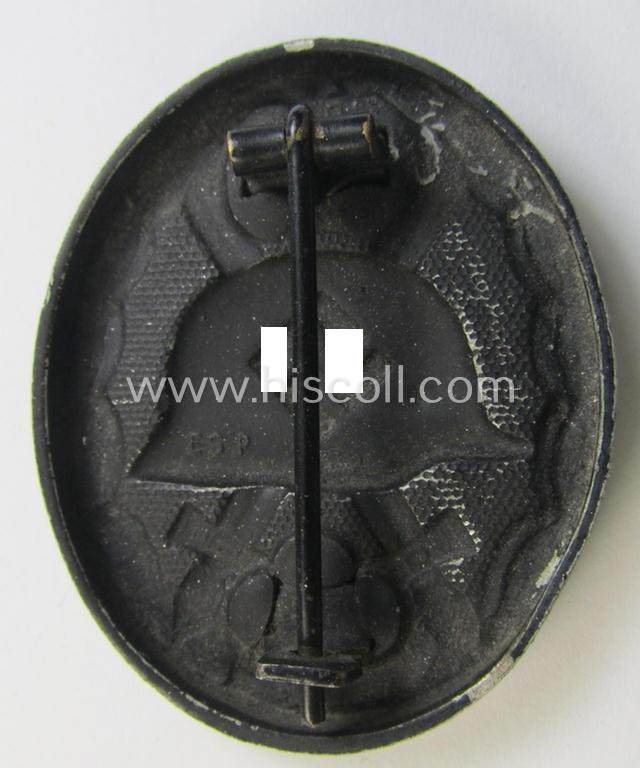 Superb - and very unusually seen! - maker- (ie. 'ES.P'-) marked example of a black-class wound-badge (or: 'Verwundeten-Abzeichen in Schwarz') being an example that was produced by the maker (ie. 'Hersteller') named: 'Eugen Schmidthaussler'