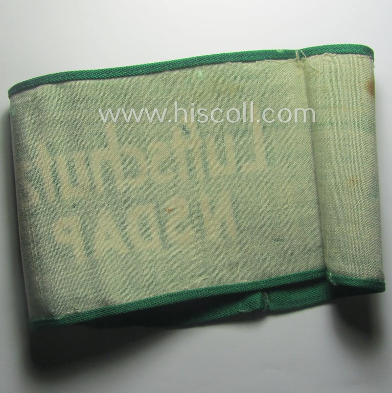 Minimally used - and most certainly rarely seen! - 'N.S.D.A.P.'- (ie. 'Luftschutz'-) related armband (ie. 'Armbinde') being of the 'entirely printed'-type showing a swastika and text: 'Luftschutz NSDAP'