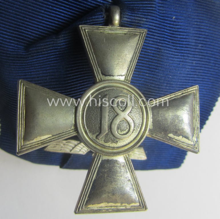 Silver-toned, WH (Heeres o. KM) so-called: 'Einzelspange' showing a: 'WH-Dienstauszeichnung 2. Stufe' (as was intended for 18 years of loyal-service) and that shows a detailed, Heeres o. KM-type-eagle-device, period-attached