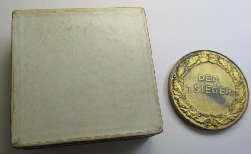 Attractive, golden-toned- (ie. 'Feinzink'-based) so-called: SA- ie. ('Sturmabteilungen'-) related, commemorative-plaque entitled: 'Kampftage der SA - Gruppe Franken - 1938' and showing the text: 'Dem 1. Sieger' and that comes in its period et...