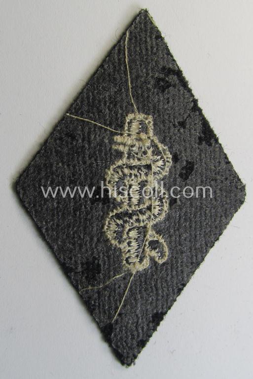 Waffen-SS-pattern, machine-embroidered and/or black- and white-coloured sleeve-insignia (ie. 'Ärmelraute') depicting a so-called: 'Aesculapus'-sign as was used and intended to signify membership within the 'SS-Sanitätsdienst'