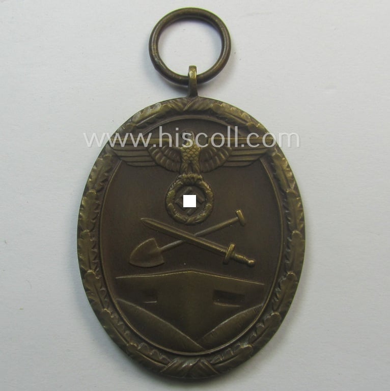 Medal-set: 'Deutsches Schutzwall Ehrenzeichen' (aka: 'Westwall'-medal) being a (typical) non-maker-marked- and/or: typical 'Buntmetall'-based specimen that comes packed in its original pouch of issue by the: 'Wilh. Hobacher'-company