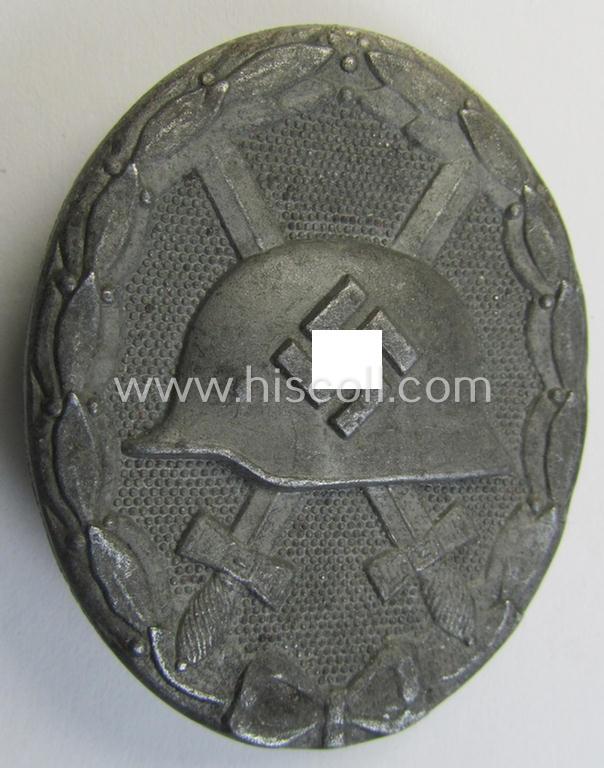 Attractive, silver-class wound-badge (or: 'Verwundeten-Abzeichen in Siber') being a non-maker-marked example that comes stored in its original, carton-based pouch as was produced by the maker (ie. 'Hersteller'): 'Steinhauer & Lück'