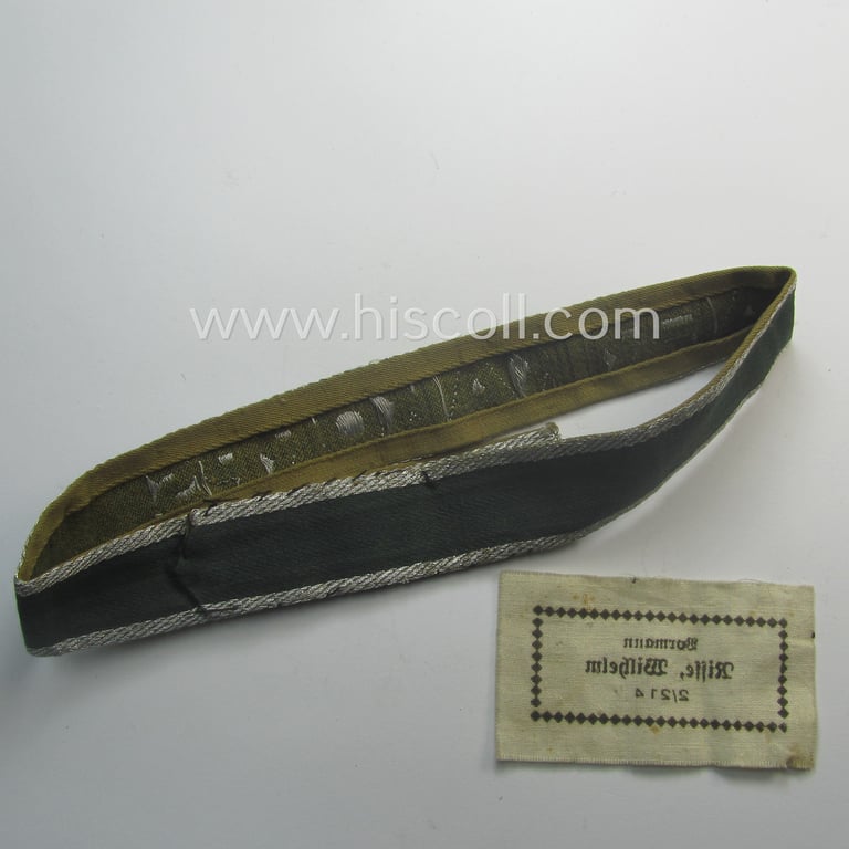 Truly worn, 'BeVo'-like cuff-title (ie. 'Ärmelstreifen') entitled: 'Afrikakorps' being a with certainty issued example that comes in an overall nice- (ie. once tunic-attached-), condition