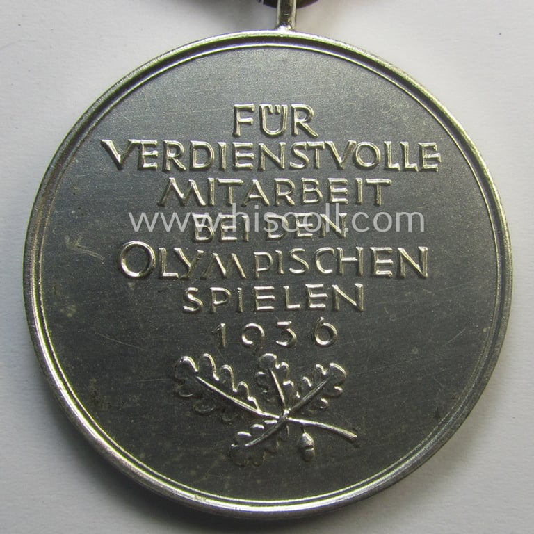 Superb, 'Deutsche Olympia-Erinnerungsmedaille 1936' being a non-maker-marked example that comes mounted onto its original ribbon (ie. 'Bandabschnitt') and that comes stored in its typical, beige-white-coloured etui