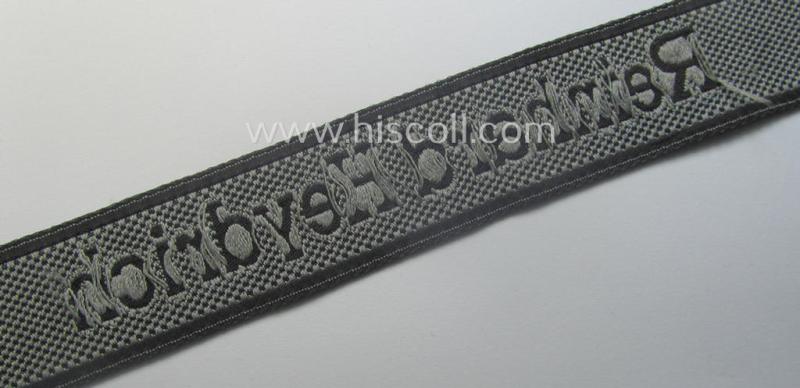 Waffen-SS, 1943-pattern cuff-title (ie. 'Ärmelstreifen') depicting the machine-woven Latin script text in silver-grey linnen as was intended for a member of the: 'SS-Geb.Jäg.-Rgts. 6. (u.11.)': "Reinhard Heydrich"