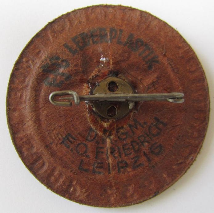 Commemorative - leather-based-, N.S.D.A.P.-related 'tinnie', being a neatly maker- (ie. 'E.O. Friedrich'-) marked example depicting an eagle-sign and two-headed horses-sign surrounded by the text: 'Gautag Ost-Hannover der N.S.D.A.P. 1937'