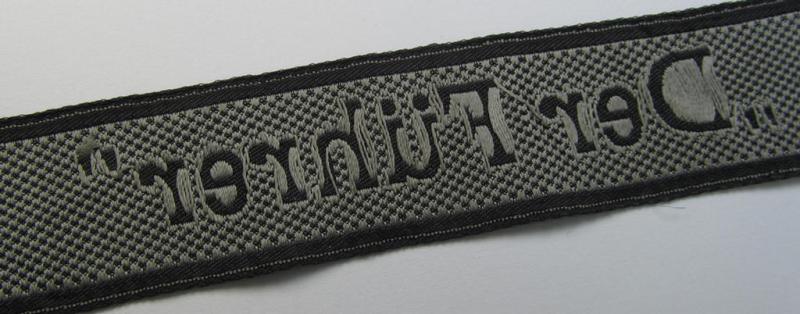 Stunning, Waffen-SS, 1943-pattern cuff-title (ie. 'Ärmelstreifen') depicting the machine-woven Latin script text in silver-grey linnen, as was intended for a member of the: 'SS-Regiment “Der Führer”