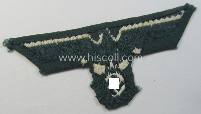 Pre- (ie. early-) war-period, WH (Heeres) cap-eagle & cocarde-set (ie. 'Schiffchenmützen-Adler u. Kokarde für Mannschaften u. Uffz.') being a cap-removed set as executed in bluish-grey-coloured linnen on a darker-green-coloured background