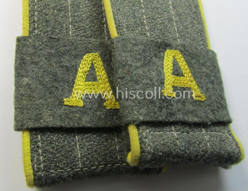 Pair of later-war-period, WH (Heeres) so-called: 'M44'-styled ie. 'simplified', EM-type shoulderstraps having a pair of 'A'-'Überschuben' attached as intended for a: 'Soldat eines Nachr.-Rgts. o. Abts.'