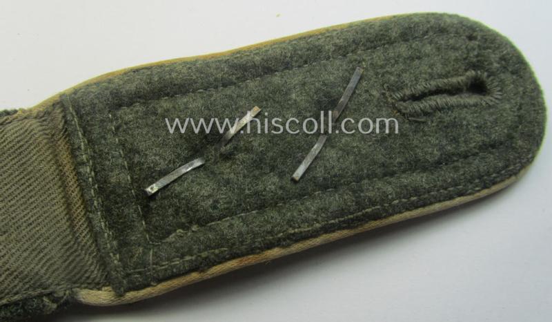 Single, WH (Heeres) NCO-type (ie. 'M40'- ie. 'M43'-pattern) shoulderstrap having the white-coloured branchcolour as was intended for - and clearly worn by! - a: 'Oberfeldwebel der Infanterie-Trpn.'