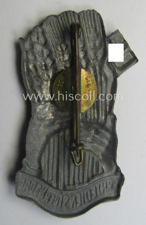 Commemorative, tarnished-silver-coloured- and/or tin-based, N.S.D.A.P.-related 'tinnie' being a non-maker-marked example depicting two hands holding some corn-plants, swastika and text that reads: 'Erntedienst der NSDAP'
