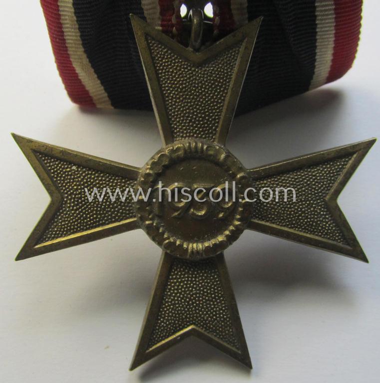 Attractive - and truly unusually seen! - golden-bronze-toned so-called: 'Einzelspange' showing a: 'Kriegsverdienstkreuz II. Klasse ohne Schw.' (or: war-merits' cross 2nd class with swords) being a very detailed- and/or 'Buntmetall'-based speci...