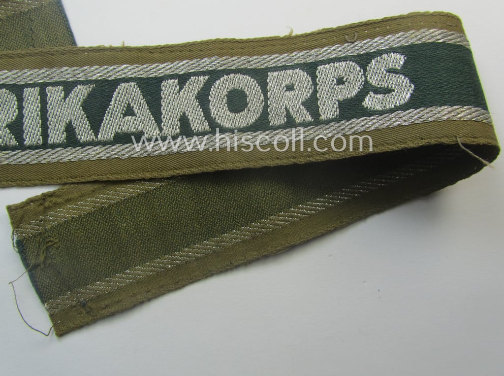 'BeVo'-like cuff-title (ie. 'Ärmelstreifen') entitled: 'Afrikakorps' being a clearly issued example that comes in an overall nice- (ie. hardly shortened- and just moderately worn-), condition