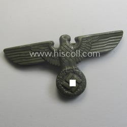 Greyish-silver-coloured- and/or: typical zinc- (ie. 'Feinzink'-) based (political-style)...