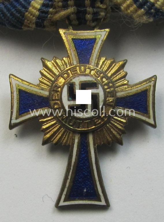 Miniature of an: 'Ehrenkreuz der deutschen Mutter - erste Stufe' (or: golden-class mothers'-cross) being a neatly maker- (ie. 'L/60'-) marked example that comes in an overall nice- (albeit moderately worn- ie. used-), condition