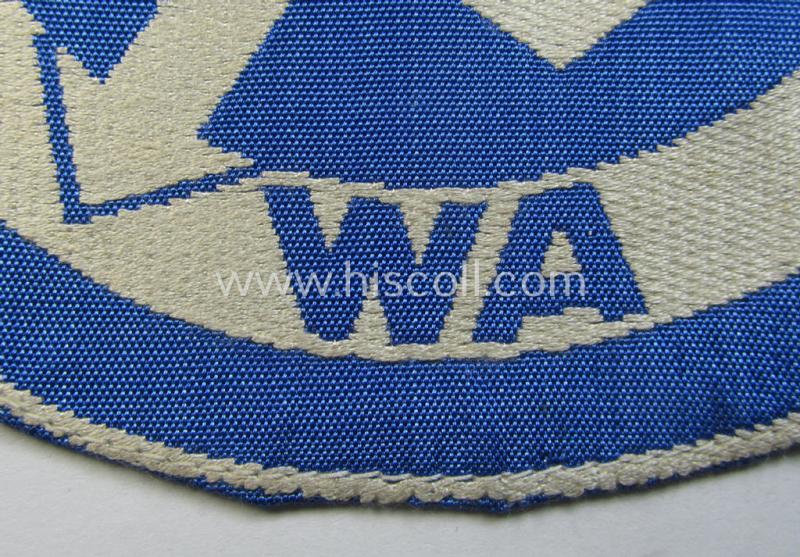 Attractive - and scarcely encountered! - SA (ie. 'Sturmabteilungen'), 'BeVo'-woven sport-shirt insignia still showing its period-attached 'RzM'-etiket as was intended for an SA-member who served within the: 'Gruppe Wartheland' (WA)