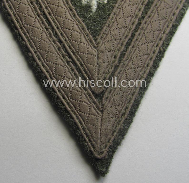 WH (Heeres) 'Armwinkel' (or: arm-chevron) as executed on typical field-grey-coloured wool as was specifically intended for usage by a soldier with the (unusually encountered!) rank of: 'Stabsgefreiter'