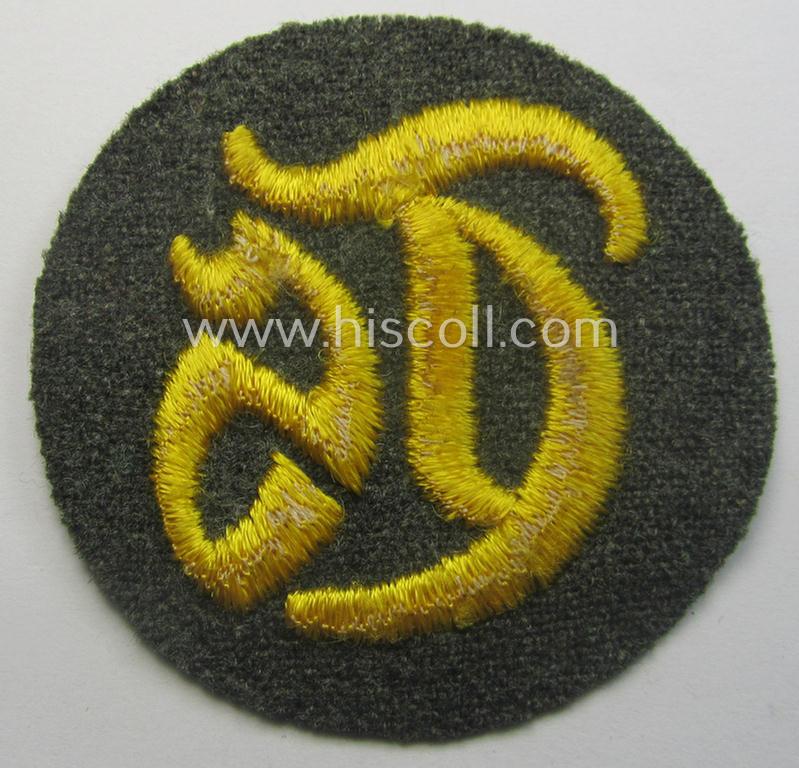 WH (Heeres) machine-embroidered, trade- and/or special-career insignia (ie. 'Tätigkeitsabzeichen') as executed on a field-grey-coloured background as was specifically intended for a: 'Truppensattlermeister'