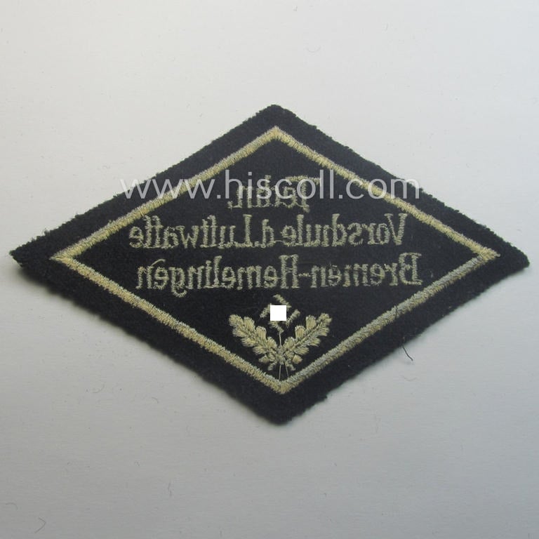 Unusual, HJ ('Hitlerjugend' ie. 'Flieger HJ'-) specialist armbadge (or: 'Schulabzeichen') depicting the text: 'Techn. Vorschule d. Luftwaffe - Bremen-Hemelingen' and that comes in an overall nice- (ie. used and/or tunic-removed-), condition