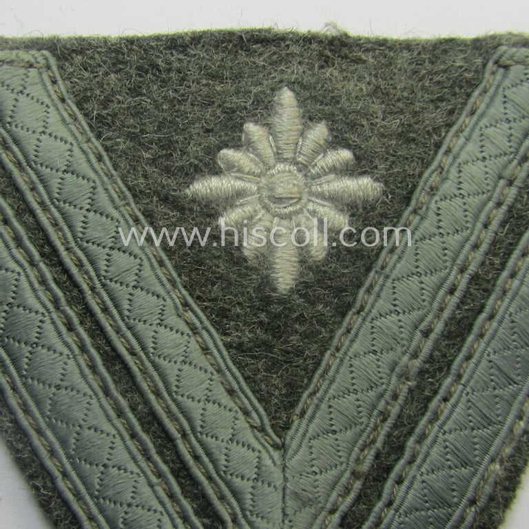 WH (Heeres) 'Armwinkel' (or: arm-chevron) as executed on typical field-grey-coloured wool as was specifically intended for usage by a soldier with the (unusually encountered!) rank of: 'Stabsgefreiter'
