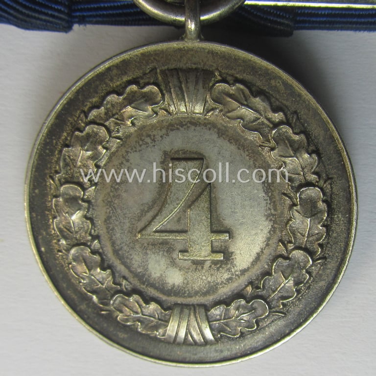 Silver-toned, WH (Heeres o. KM) so-called: 'Einzelspange' showing a: 'WH-Dienstauszeichnung 4. Stufe' (as was intended for 4 years of loyal-service) and that shows a detailed, Heeres o. KM-type-eagle-device, period-attached