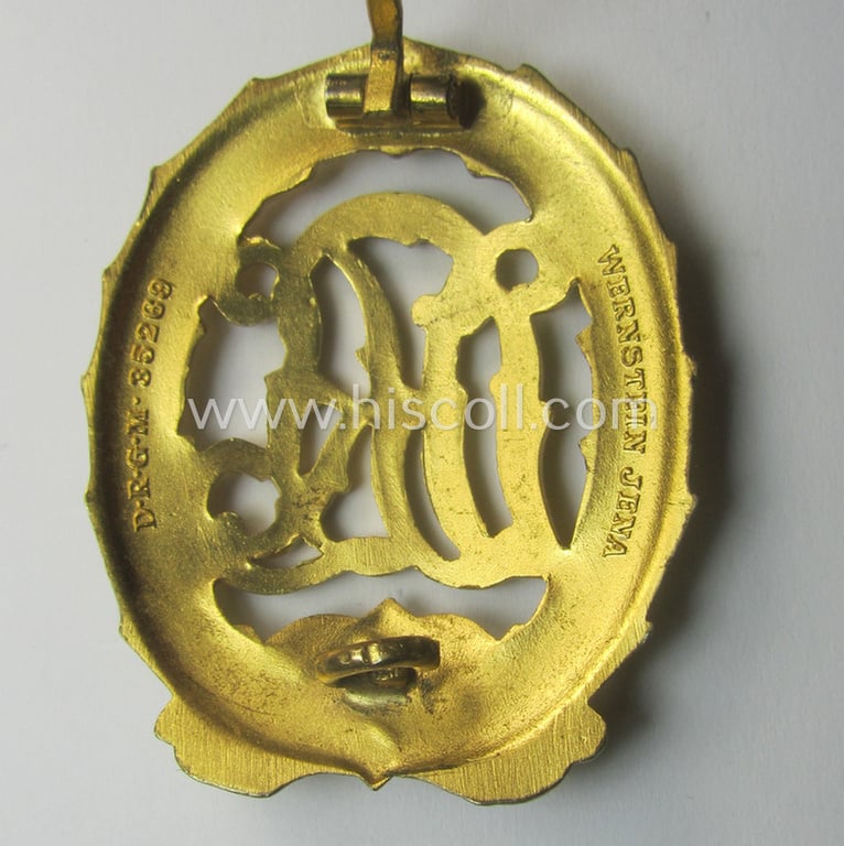 Minimally used - and truly rarely found! - example of a: 'Reichssportabzeichen DRL in Gold' (or: DRL sports'-badge in gold) being a just moderately worn- ie. used example that is nicely maker- (ie. 'Wernstein - Jena'-) marked on its back