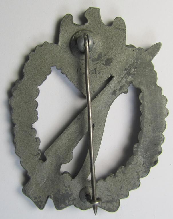 Attractive - and moderately used! - 'Infanterie-Sturmabzeichen in Silber' (or: silver-class infantry-assault badge ie. IAB) being a neatly maker- (ie. 'MK 1'- or: 'Metall u. Kunststoff'-) marked example as executed in silverish-coloured 'Feinz...