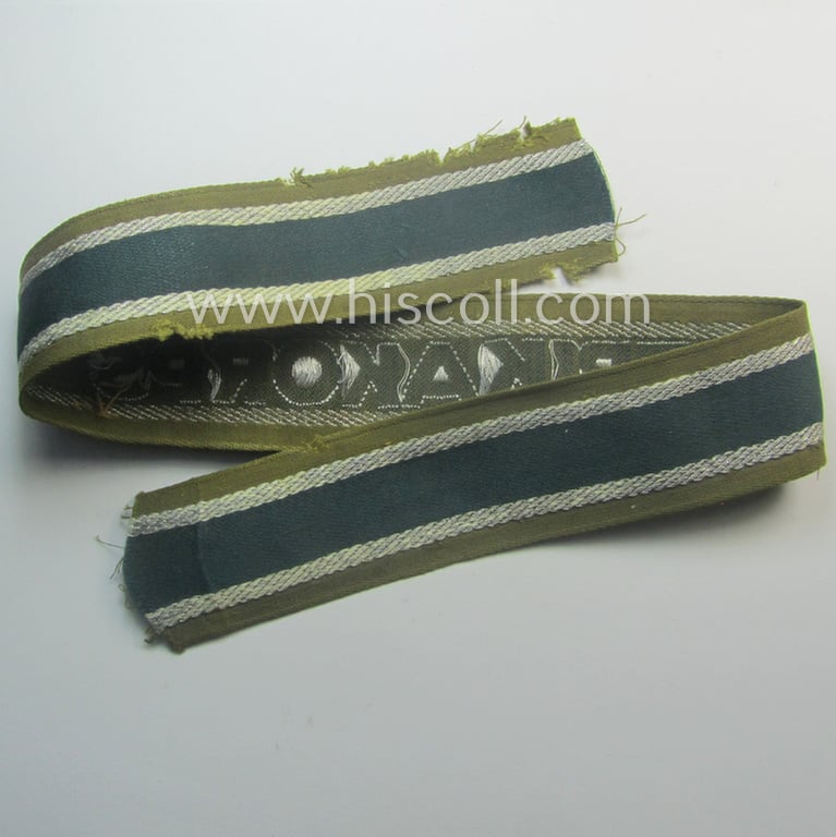 Truly worn, 'BeVo'-like cuff-title (ie. 'Ärmelstreifen') entitled: 'Afrikakorps' being a with certainty issued example that comes in an overall nice- (ie. hardly shortened- and/or once tunic-attached-), condition