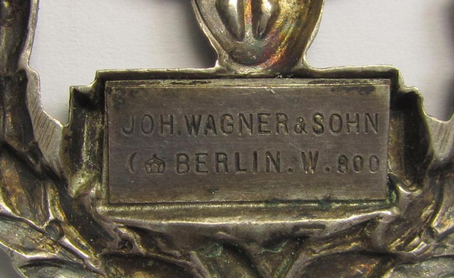 German (ie. Preussen), pre-WWI-period- and/or genuine silver-based, so-called: 'Preussisches Staats-Eisenbahn-Erinnerungszeichen für 25 Jahre Treue Dienste' (being a clearly maker- ie. 'Joh. Wagner & Sohn - Berlin'-marked example)