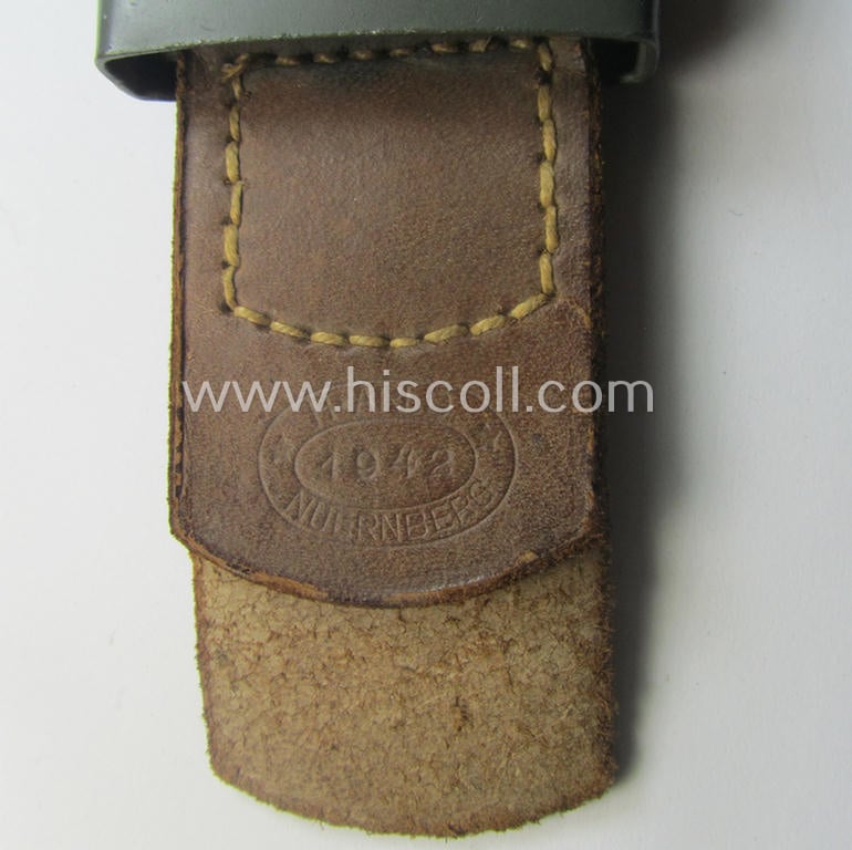 'Virtually mint', 'standard-issue'-pattern, WH (Heeres) field-grey-toned- and steel-based belt-buckle being a maker- (ie. 'H.A.41'-) marked example that comes mounted onto its: 'H. Arld - Nürnberg'-marked and/or: '1942'-dated tab