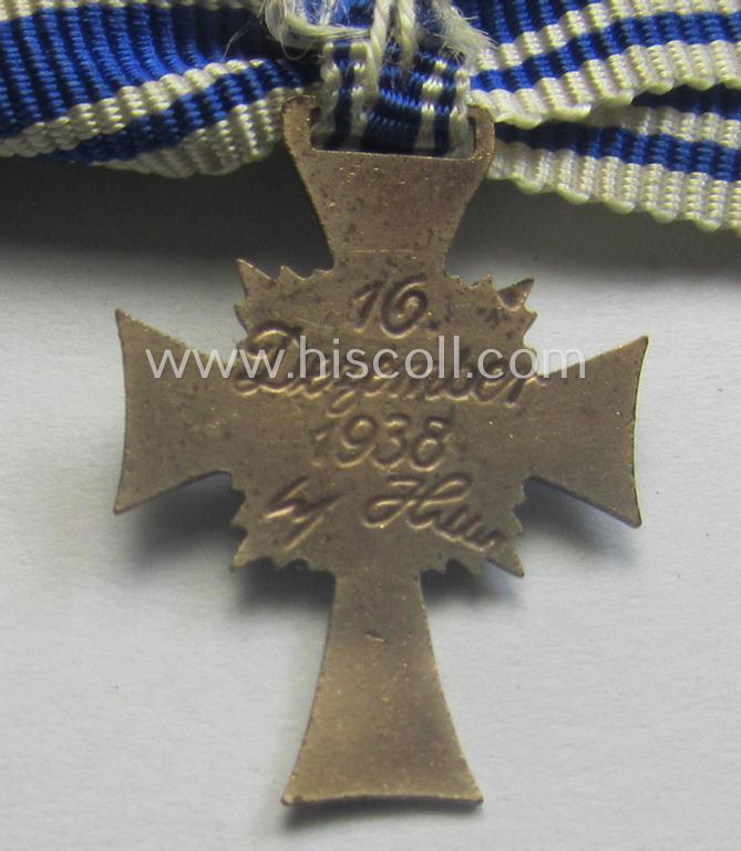 Miniature of an: 'Ehrenkreuz der deutschen Mutter - zweite Stufe' (or: silver-class mothers'-cross) being a non-maker-marked example that comes in an overall nice- (albeit moderately worn- ie. used-), condition