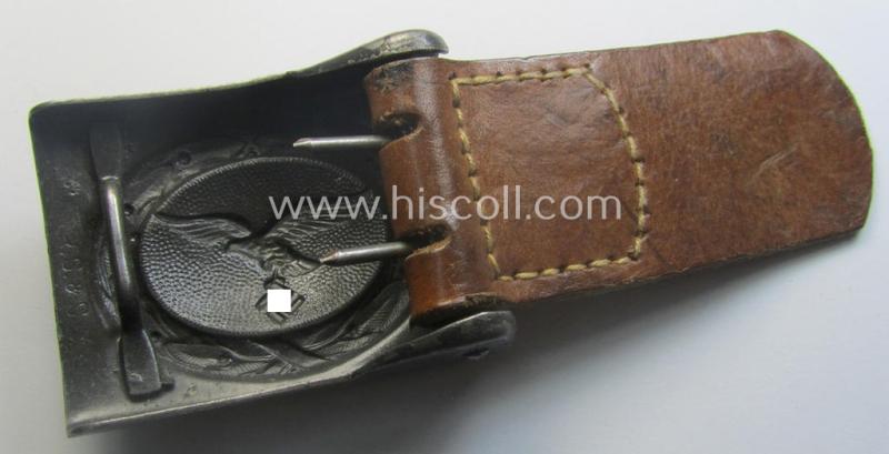 WH (Luftwaffe) darker-blue-coloured- and/or steel-based belt-buckle, being a neatly maker- (ie. 'R. Sieper & Söhne'-) marked and/or: '1942'-dated example that comes mounted onto its period, natural-coloured and/or leather-based tab