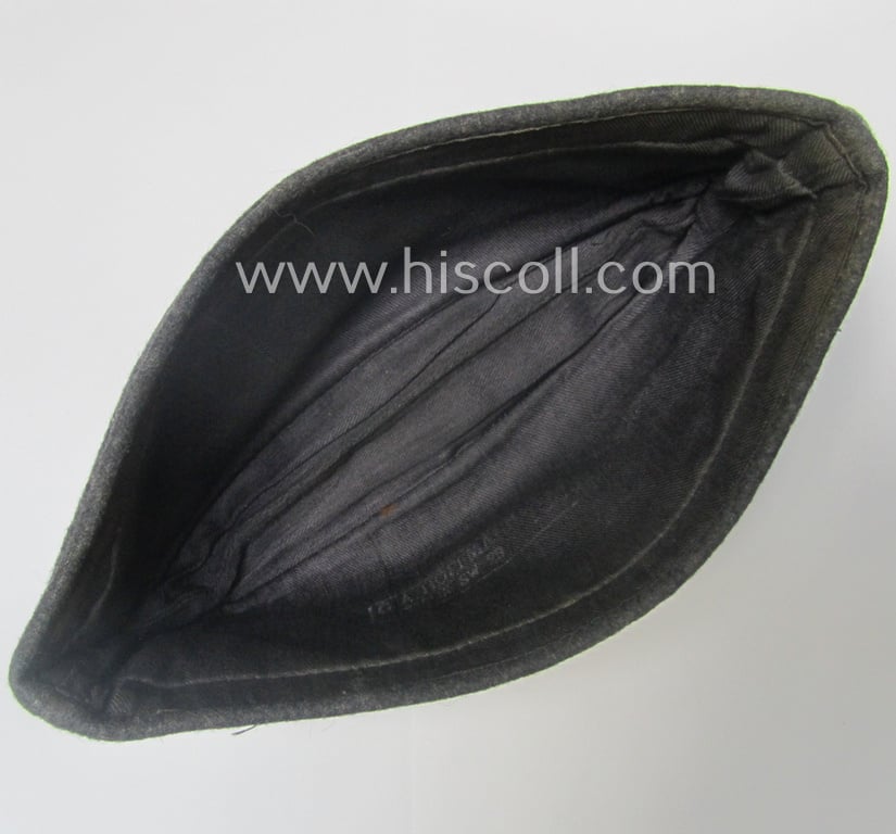Attractive - albeit moderately used- ie. worn - WH (Luftwaffe) bluish-grey-coloured, EM- (ie. NCO-) type side-cap (ie. 'Schiffchenmütze für Mannschaften u. Unteroffiziere der Luftwaffe')